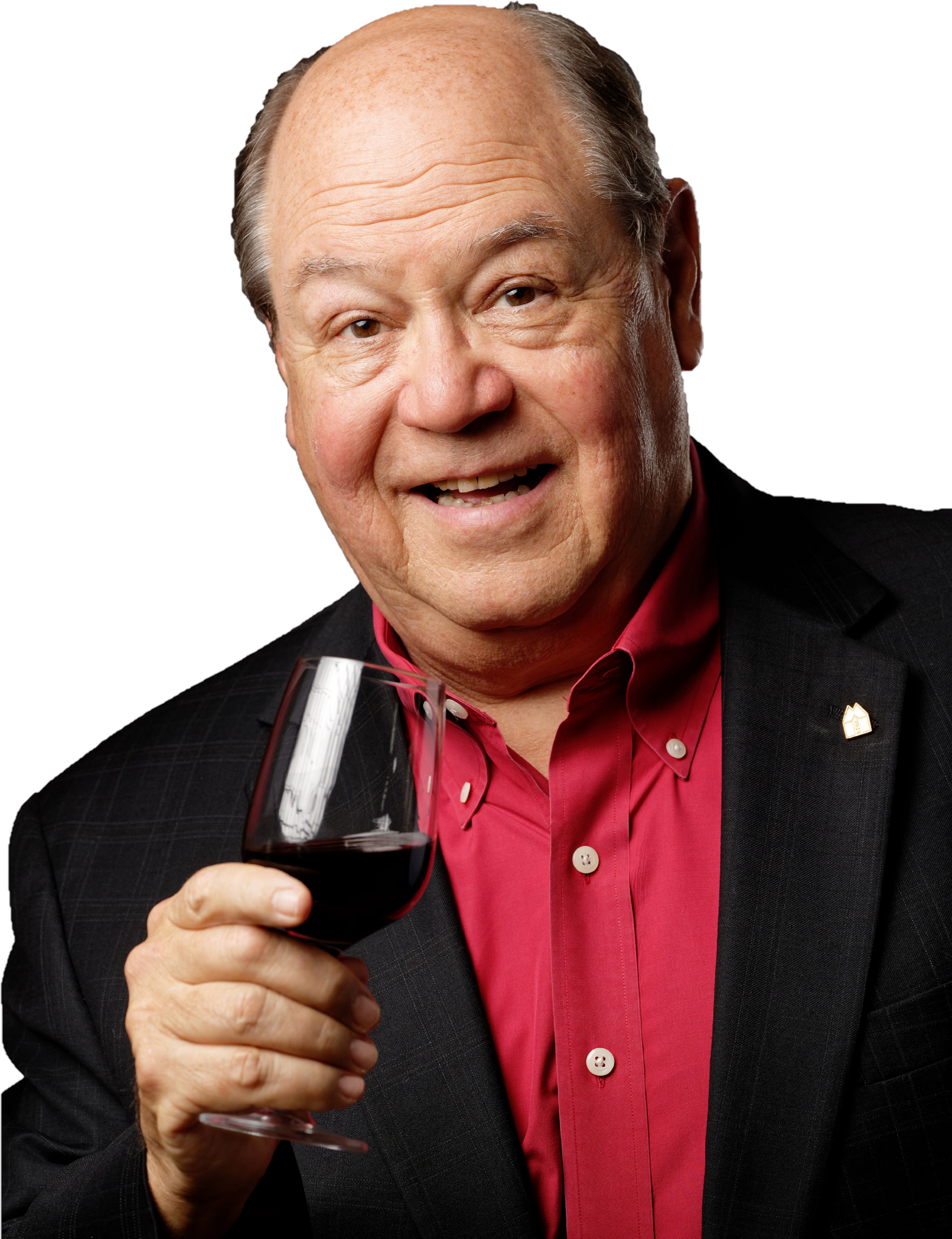 Bob Monica standing in a black blazer and red collared shirt while holding a glass of wine in his right hand.