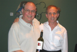 Bob Monica in a white collared shirt standing to the left of Peter Franus who is also wearing a white collared shirt.